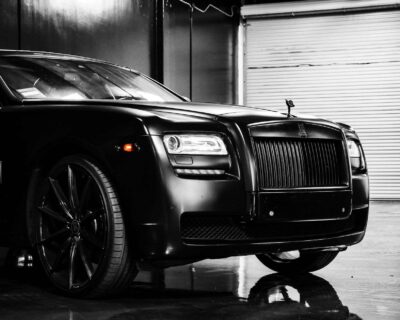 details of expensive black car in garage Login/Singup